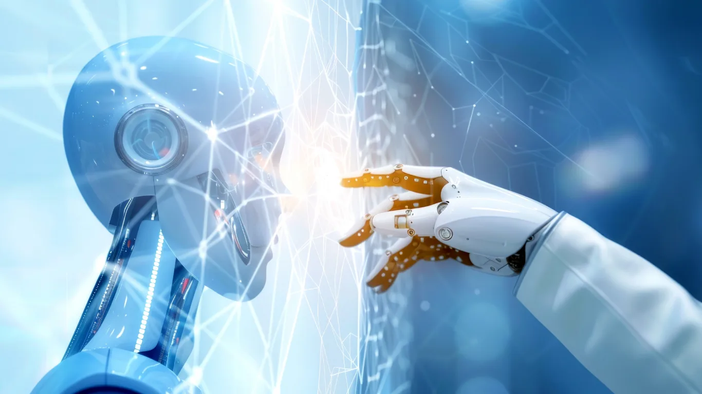 Blue robot head facing a white robotic hand reaching to touch fingertips, symbolizing human–robot collaboration.