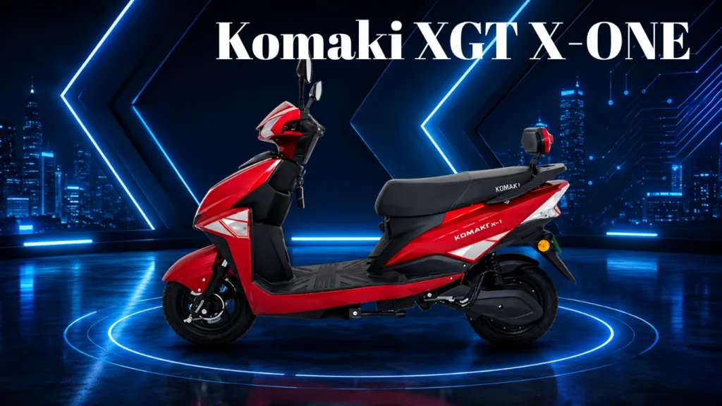Red Komaki XGT X-ONE scooter in a neon blue futuristic showroom with circular light rings.