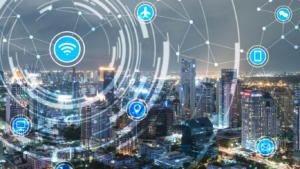 Illustrated smart city with interconnected icons (Wi‑Fi, cloud, airplane, phone, location pin, email) forming a network across skyline.